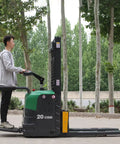 Heavy Hitter Stand Up Electric Pallet Jack With 3300 Lb Capacity And 14.7 Ft Lift Height Plug And Play Rig in use outdoors.