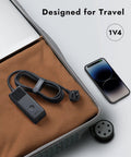 PD 40W USB C Charging Hub With 3 AC Outlets And 2 USB C Ports And 1 USB A Port in suitcase next to smartphone, travel-ready.