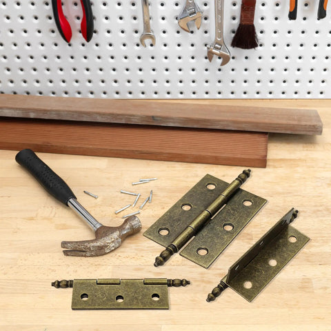 Four Pack Antique Bronze Folding Butt Hinges Measuring 2.5 By 1.69 Inches For Cabinet Doors Rustic Windows Wood Boxes And Heavy Duty Vintage Brass Finish Furniture Hardware That Is Badass Rust Resistant And Gonna Work Sweet For Yall with hammer and screws on workbench.