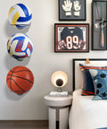 Metal Ball Holder Rack Wall Mounted Two Piece Set Black Heavy Duty Wall Display Storage For Soccer Basketball Volleyball Rugby Football Easy Install With Screws in bedroom setting.