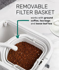 Removable filter basket with ground coffee ready for brewing in the Generous 3 Quart White Stainless Steel Iced Tea And Cold Brew Coffee Brewing Pitcher.