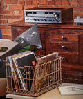 Person inspecting vinyl records near Audio-Technica At-Lp120Xusb-Bk Direct Drive Turntable Analog And USB Fully Manual Hi-Fi 3 Speed.