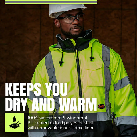 Man wearing Hi Vis Bomber Jacket For Men With ANSI Class 3 Waterproof Safety, Reflective Strips, Detachable Hood, helmet, and glasses.