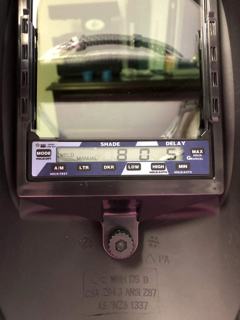 Close-up of the control panel on the TrueView 9300 Welding Helmet with 5 Sensors, showing shade and delay settings on the display screen.