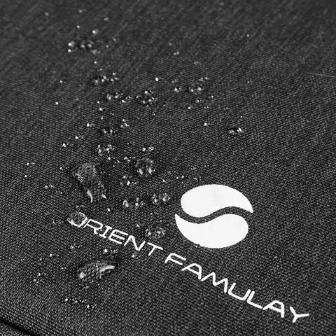 Close-up of Waterproof Electronics Organizer Bag With Double Layer Design, showing water droplets on black nylon material.