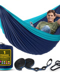 Durable Nylon Camping Hammock Chair With 400 Lbs Capacity Single Or Double Size Tree Straps Attached Carry Bag Lightweight Portable For Travel Backpacking Beach Backyard Blue And Light Blue, shown with man seated and accessories included