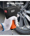 Pneumatic Air Impact Wrench With 3/8 Inch Square Drive And 690 Ft Lbs Of Knuckle Busting Torque Lightweight Aluminum Body used with one hand on a car wheel.