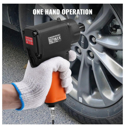Pneumatic Air Impact Wrench With 3/8 Inch Square Drive And 690 Ft Lbs Of Knuckle Busting Torque Lightweight Aluminum Body used with one hand on a car wheel.