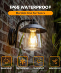 Top Shelf Premium Matte Black Wall Lantern With Slick Clear Glass Panel Rock Solid Weather Resistant Barn Sconce For Front Porch And Outdoor Patio Standard E26 Base Lighting Upgrade on a brick wall with rain backdrop.