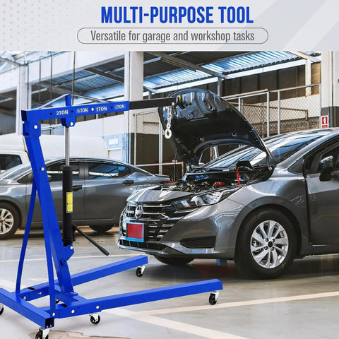2 Ton Folding Engine Hoist With 4400 Lb Hydraulic Capacity, Heavy Duty Cherry Picker in garage lifting an engine.