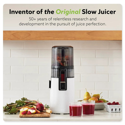 Hurom H70 Cold Press Juicer Easy To Clean Masticating Slow Juicer with black design on kitchen counter surrounded by fruits.