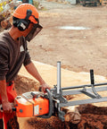 Worker using 36 Inch Chainsaw Mill Kit For Planking And Milling A Portable Gas Powered Saw Mill To Tackle Large Logs