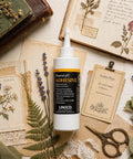 Neutral pH All Purpose Glue For Book Binding And Crafts, 8 Oz, Acid Free Adhesive Dries Clear And Flexible, product on table with crafts