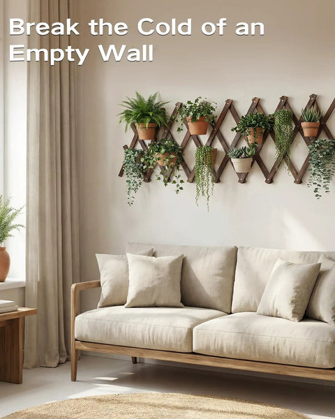 Expandable Garden Trellis System For Indoor And Outdoor Use with wooden lattice and plants on wall above a beige sofa.