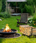 Curved Firewood Rack, 48-Inch Heavy Duty Log Holder For Indoor And Outdoor Use by a fire pit with stacked logs in a garden setting