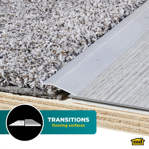 Silver Durable Aluminum Carpet Trim Built To Last One And Three Eighths Inch By Thirty Six Inch with carpet and laminate transition.