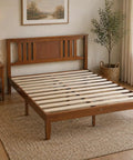 Rock Solid Queen Platform Bed Frame With Attached Brown Wood Headboard And Heavy Duty Pine Slats in a cozy bedroom setting.
