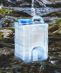 15 Liter Camping Water Container With Lid For Outdoor Use, Food Grade PC Water Jug next to a stream in nature