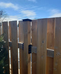 Top Shelf Heavy Duty Privacy Fence Brackets For Standard 2x4 Wood Railings Pre Drilled Galvanized Steel 8 Pack attached to wooden fence.
