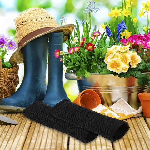 Heavy Duty Cut Resistant Arm Sleeves Black Two Pack Thorn Proof Guard For Mechanics And Landscapers, shown with gardening tools.