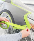 Applying Pro Grade Performance Masking Tape 233 Plus, 24 mm Wide By 55 M Long, Flexible Backing on car for precise paint lines