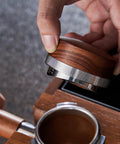 Killer 54Mm Bottomless Portafilter Set For Breville Espresso Machines, wooden calibrated tamper in use.