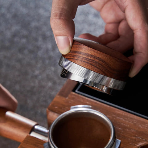 Killer 54Mm Bottomless Portafilter Set For Breville Espresso Machines, wooden calibrated tamper in use.