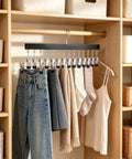 Slick Vertical Closet Organizer With Ten Heavy Duty Pant Clips For No Fuss Dorm And Apartment Storage, featuring clips holding various clothing.