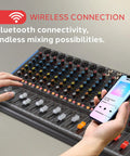 Hands using Bluetooth on 12 Channel Console Style DJ Mixer With Bluetooth And USB Audio Interface, 8 XLR And Combo Inputs, Sub Output