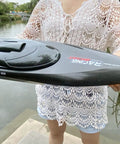 Person holding RTR 25.5 Inch Brushless Remote Control Boat With 2.4GHz Radio, 4WD Speed Watercraft, black waterproof hull