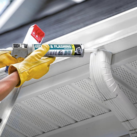 Applying Butyl Flex Gutter And Flashing Sealant White 10.1 Oz Exterior Waterproof Sealant on gutter joint with caulking gun
