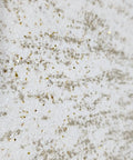 Close-up of Top Shelf Vinyl Textured Wallpaper In Crisp Off White Cream Accented With Shimmery Gold Mica Chips.