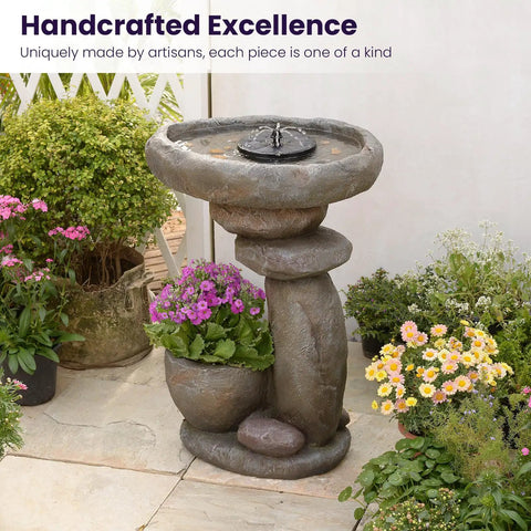 Solar Fountain For Bird Bath And Planter, freestanding rock waterfall with LED lights in a garden setting, featuring plants.
