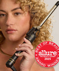 Woman holding 24K Gold Curling Iron With Extended 6 Inch Barrel For Tousled Curls Long Lasting Heat For Faster Styling Pro Grade Tool