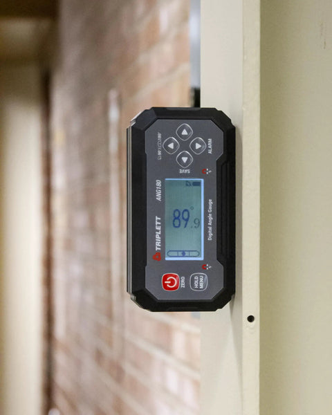 Precision Digital Level And Angle Gauge Finder With Bullseye Display Zero Offset Setup Dual Axis Calibration Audible Alert Magnetic Mount For Workshops mounted on a wall showing 89.9 degrees.