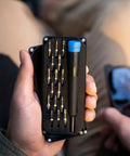 Minnow Driver Kit Pocket Sized Screwdriver And Portable Bit Set For On The Go Fixes A Handy Tiny Tool Kit shown in a hand