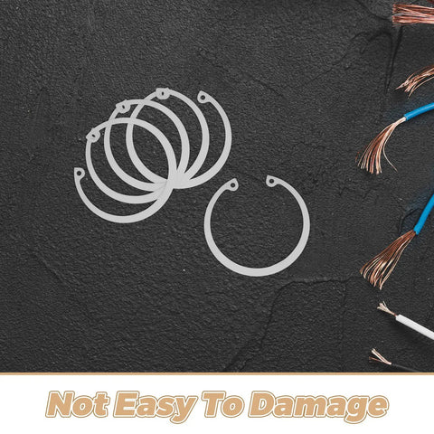 C Shaped Retaining Ring Set Five Piece Stainless Steel Snap Rings shown on a textured black surface with wires.
