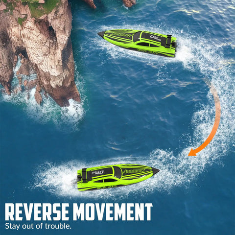 Two green brushless RC boats for adults with dual rechargeable batteries racing in reverse on a lake near rocky cliffs.