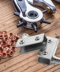 Close-up of Stainless Steel Glass Door Hinges for 5 to 7mm Thick Glass, shown with tools on a wooden table.