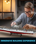 Man assembling Must Have Battleship Building Set For Adults And Teens 14 Plus Massive 1883 Piece USS CV 6 Enterprise Warship Kit