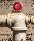 Power Switch Lockout Cover For Emergency Stop Buttons And Push Switches, Built Tough Industrial Safety Protector, mounted on pipe.