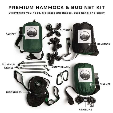 All In One Camping Hammock Kit With Bug Net And Rain Fly showing contents including rainfly, tree straps, carabiners, and stakes
