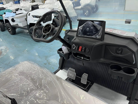 Interior of Full Size Four Plus Two Seater Electric Golf Cart White featuring dashboard, pedals, and steering wheel.