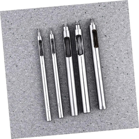 Five metal leather round punch tools for belt hole punching, used in falconry, hobbies, crafts, and DIY projects, on a grey surface.