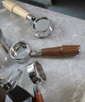 Level Up Your Home Barista Setup With This 58mm Bottomless Portafilter For Breville Dual Boiler Oracle Espresso Machine Rosewood Handle with accessories.
