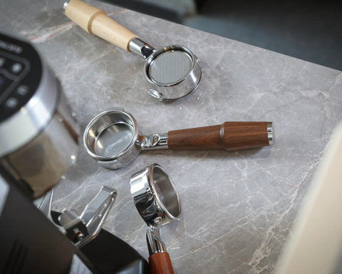 Level Up Your Home Barista Setup With This 58mm Bottomless Portafilter For Breville Dual Boiler Oracle Espresso Machine Rosewood Handle with accessories.