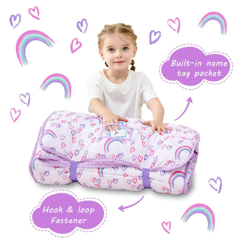 Toddler holding an Extra Large Toddler Nap Mat With Pillow And Blanket For Daycare And Preschool, rainbow design, built-in name tag