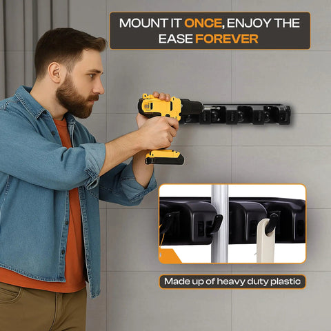 Person installing Heavy Duty ABS Plastic Broom Holder With Five Auto Adjustable Slots And Six Retractable Hooks on wall