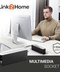 Person working at desk with Space Saver Pop Up Socket With USB And Type C Quick Charge 3 Outlets In One Concealed Receptacle.