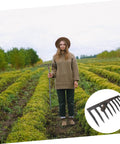 Person holding Heavy Duty Soil Rake For Gardening And Farming Plowing Aerating And Mixing Soil Tough As Nails Durable Steel Rake Tool